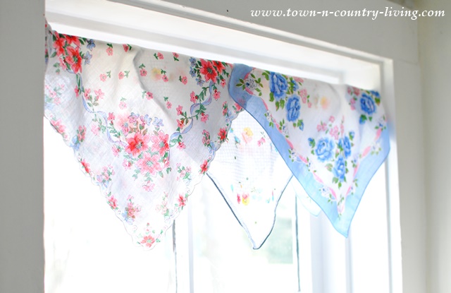 Create a cottage style window treatment with vintage hankies.