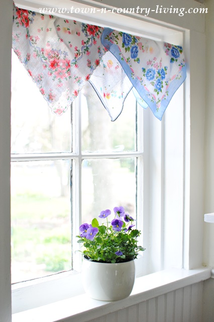 Create a cottage style window treatment with vintage hankies.