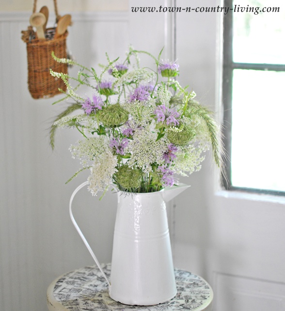 Purple and White Wildflowers in a White Enamel Pitcher