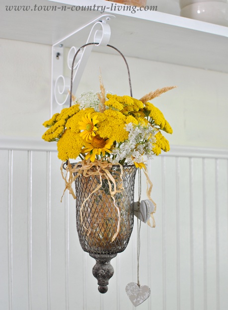 Yellow Wildflowers in a Farmhouse Country Kitchen via Town and Country Living