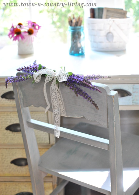 Flowers added to a painted desk chair via Town and Country Living