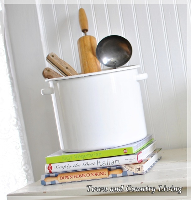 Wooden utensils in enamel pot via Town and Country Living