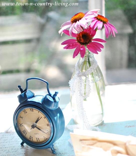 Blue tabletop alarm clock from Home Goods via Town and Country Living