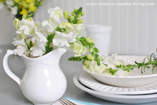 Snapdragons in a white ironstone pitcher via Town and Country Living