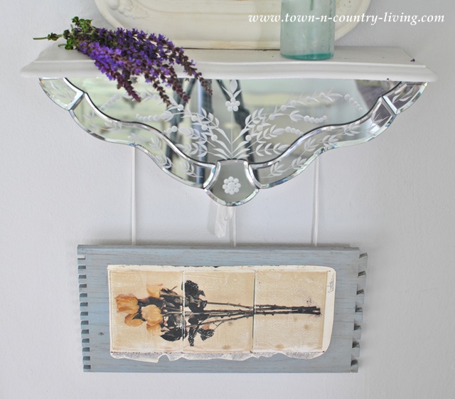 Vintage mirror vignette via Town and Country Living