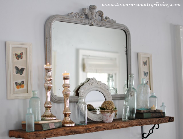 Glass and mirrors vignette at Town and Country Living