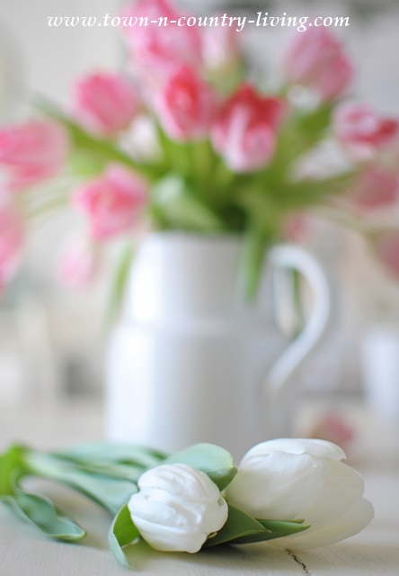Pink and white tulips in white ironstone