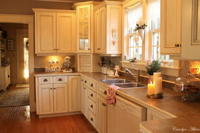 White traditional style kitchen served with a bit of romance