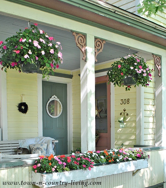 Farmhouse Front Porch with Hanging Baskets and Flower Box