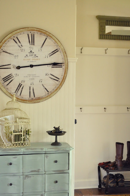 Front entry with convenient coat hooks and an oversized clock