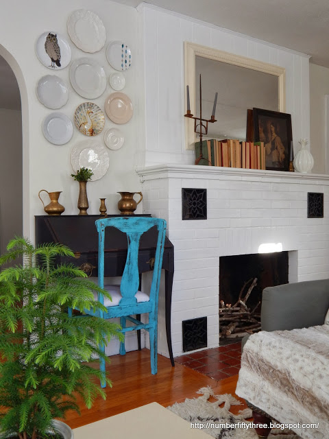 Painted brick fireplace in living room