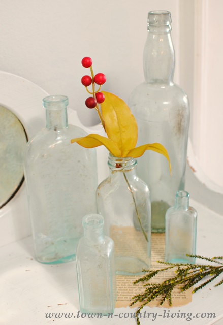 Vignette of vintage green glass bottles