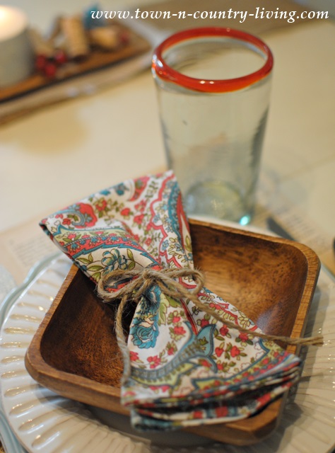 Paisley napkins add color to a rustic Fall table setting