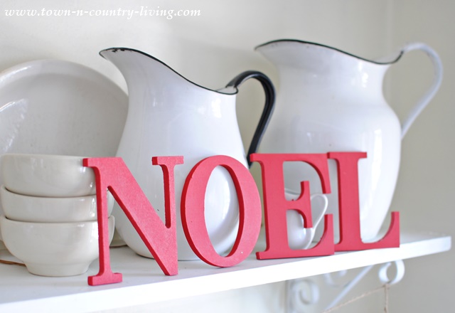 Wooden letters painted red spell NOEL. One of many simple Christmas decorating ideas.