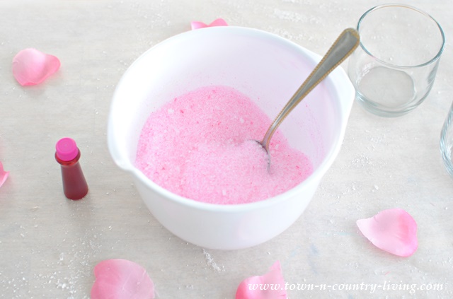 Epsom salts dyed pink with food coloring to make frosted votive candle holders.