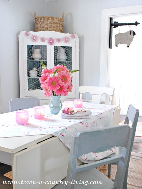 Pink Gerbera Daisies create a whimsical centerpiece in my farmhouse dining room