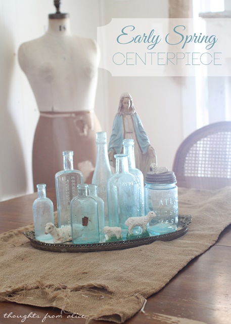 Early Spring Centerpiece created with vintage aqua bottles