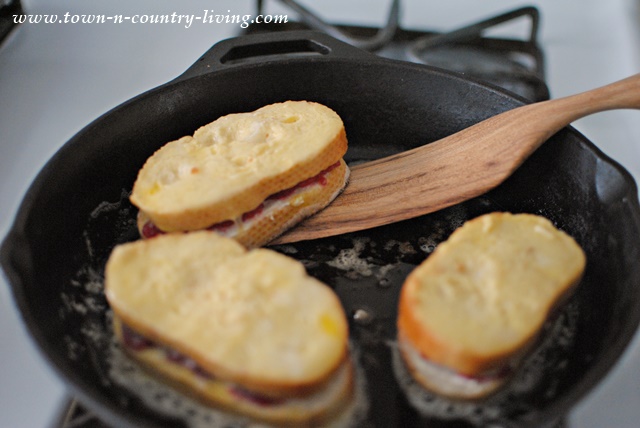 Flipping stuffed French toast with a wooden spurtle