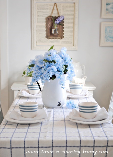 Spring Dining Room in Blue and White. The vintage tablecloth was the inspiration .