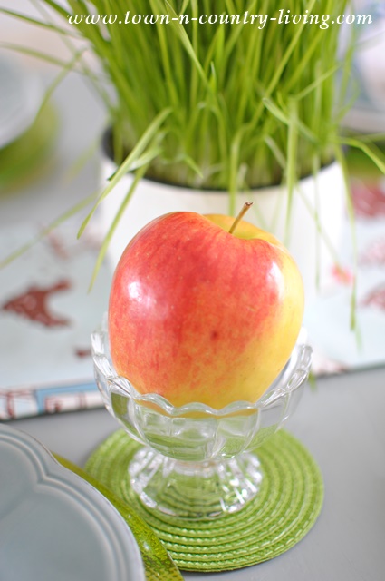 Apples in Ice Cream Dishes at a Spring Table Setting