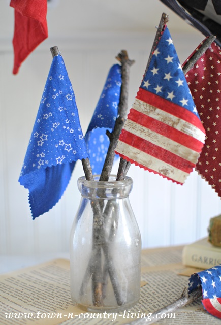 DIY Mini Flags made with sticks and swatches of fabric