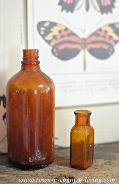 Vintage Brown Bottles on a Summer Mantel