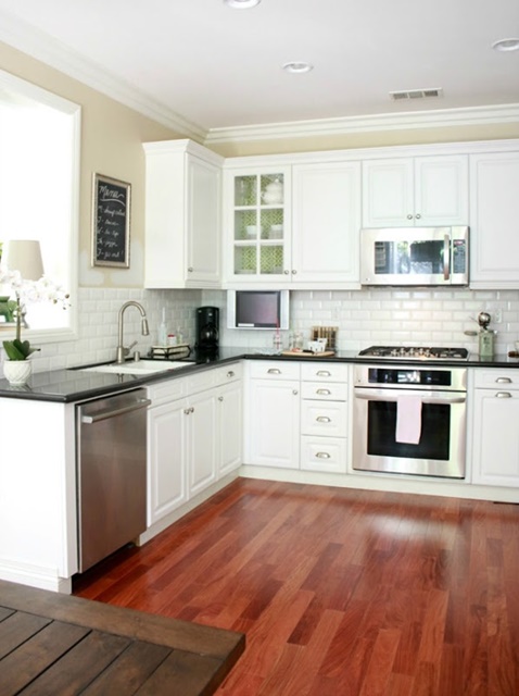 White Kitchen with Wood Floors